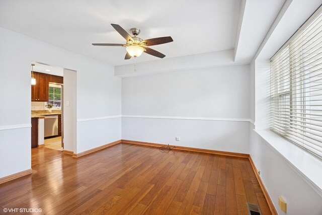 751 Essington Ln, Buffalo Grove, IL 60089 - unfurnished room featuring a ceiling fan, light wood finished floors, and baseboards