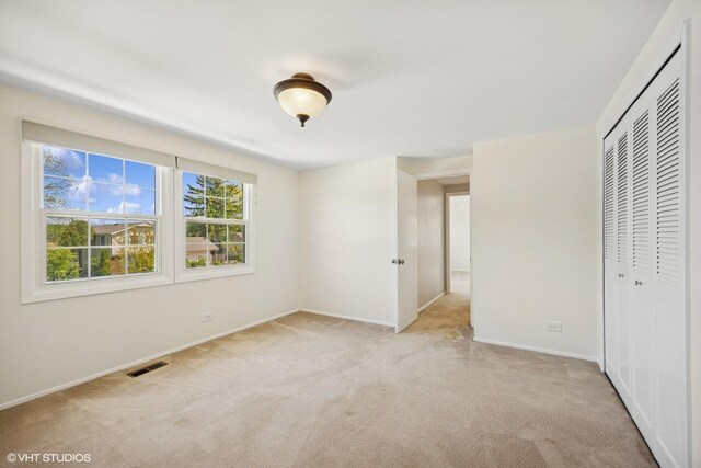751 Essington Ln, Buffalo Grove, IL 60089 - unfurnished bedroom with carpet floors, a closet, and baseboards