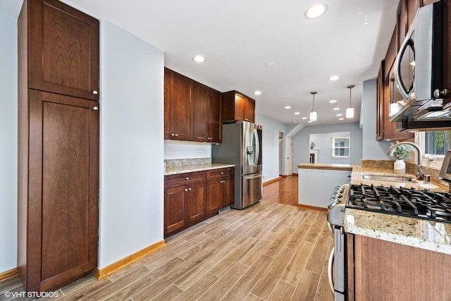 751 Essington Ln, Buffalo Grove, IL 60089 - kitchen with stainless steel appliances, a sink, light wood-type flooring, baseboards, and recessed lighting