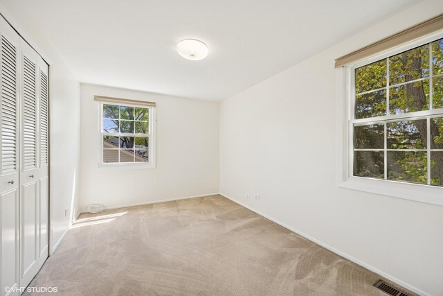 751 Essington Ln, Buffalo Grove, IL 60089 - unfurnished bedroom featuring carpet floors, a closet, and baseboards