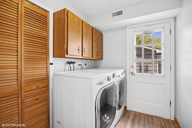 751 Essington Ln, Buffalo Grove, IL 60089 - laundry area with cabinet space, light wood-style floors, and washing machine and clothes dryer