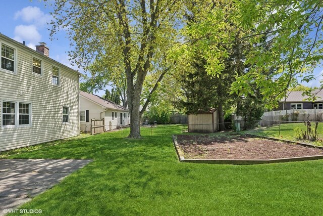 751 Essington Ln, Buffalo Grove, IL 60089 - view of yard with a storage shed and an outdoor structure