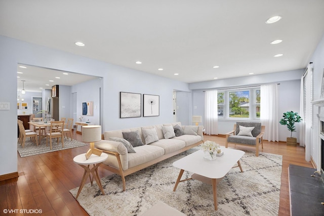751 Essington Ln, Buffalo Grove, IL 60089 - living area featuring light wood-style floors, recessed lighting, and a fireplace with flush hearth