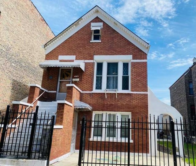 4803 S Honore St, Chicago, IL 60609 - view of front facade featuring brick siding, a fenced front yard, and a gate