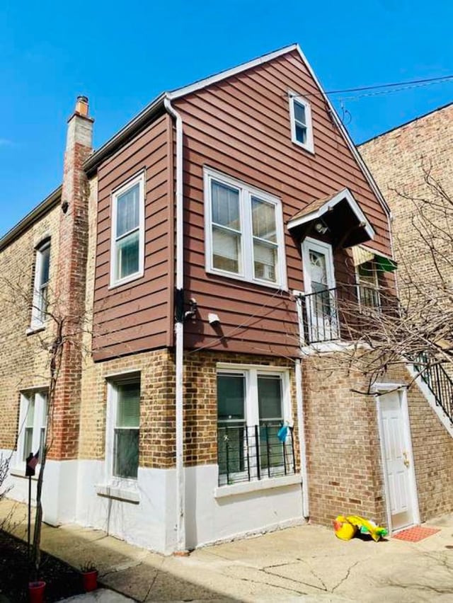 4803 S Honore St, Chicago, IL 60609 - view of property exterior with brick siding and a chimney