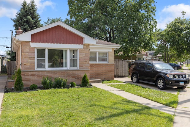 8639 Plainfield Rd, Lyons, IL 60534 - bungalow-style home with brick siding and a chimney