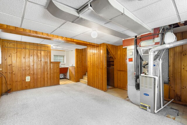 8639 Plainfield Rd, Lyons, IL 60534 - finished below grade area featuring a drop ceiling, stairs, wooden walls, carpet floors, and heating unit