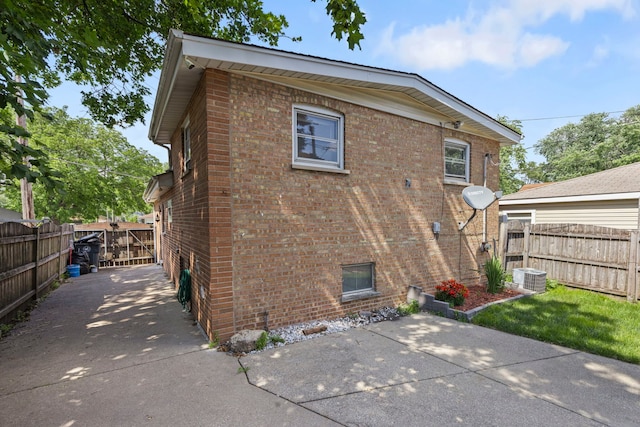 8639 Plainfield Rd, Lyons, IL 60534 - view of side of property featuring brick siding and a patio