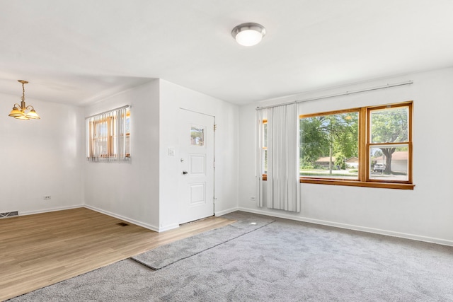 8639 Plainfield Rd, Lyons, IL 60534 - entryway featuring plenty of natural light, a chandelier, and wood finished floors
