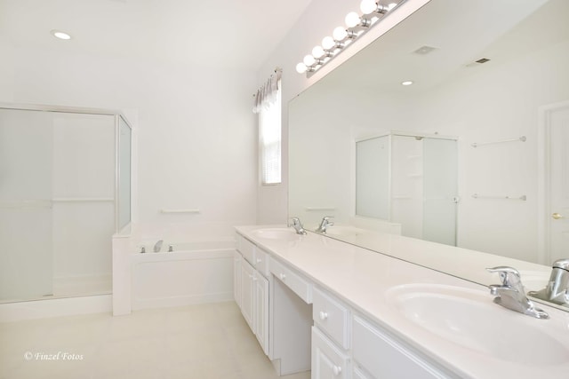 11315 Nelson Dr, Huntley, IL 60142 - bathroom featuring a bath, a stall shower, and double vanity