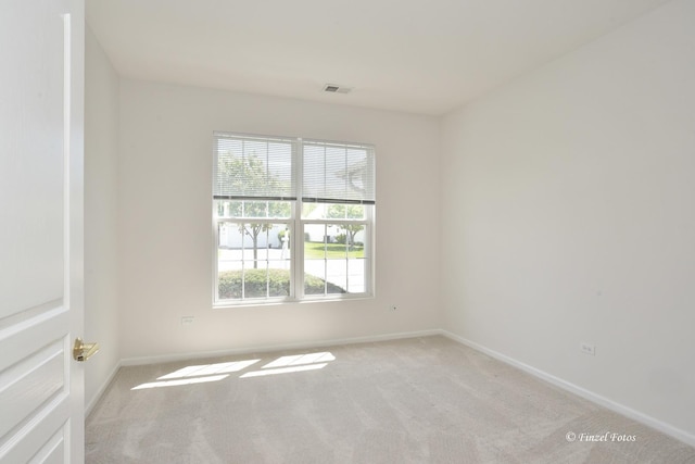 11315 Nelson Dr, Huntley, IL 60142 - empty room featuring healthy amount of natural light, light colored carpet, and baseboards