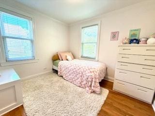 1010 N Patton Ave, Arlington Heights, IL 60004 - bedroom with crown molding, dark wood-style flooring, and baseboards