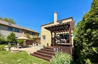 1010 N Patton Ave, Arlington Heights, IL 60004 - rear view of property with a patio, a pergola, and a lawn