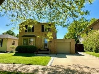 1010 N Patton Ave, Arlington Heights, IL 60004 - traditional-style home with concrete driveway, a front yard, and a garage