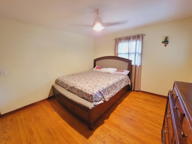 511 N Berwick Blvd, Waukegan, IL 60085 - bedroom featuring baseboards, light wood-type flooring, and a ceiling fan