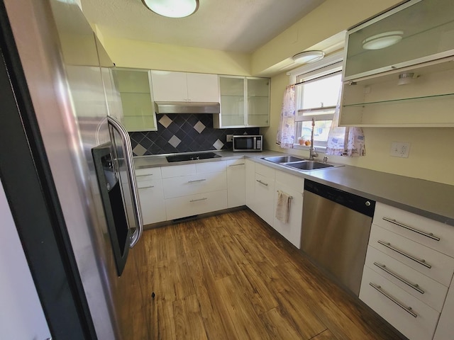 511 N Berwick Blvd, Waukegan, IL 60085 - kitchen featuring stainless steel appliances, a sink, dark wood-type flooring, tasteful backsplash, and white cabinets