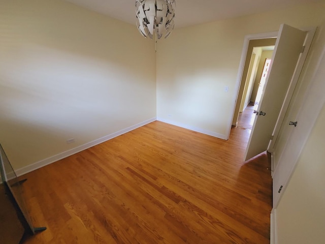 511 N Berwick Blvd, Waukegan, IL 60085 - spare room with baseboards and light wood-type flooring