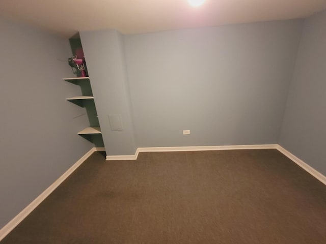 511 N Berwick Blvd, Waukegan, IL 60085 - spare room featuring dark carpet and baseboards