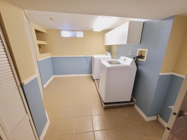 511 N Berwick Blvd, Waukegan, IL 60085 - laundry room featuring light tile patterned floors, cabinet space, washer and dryer, and baseboards
