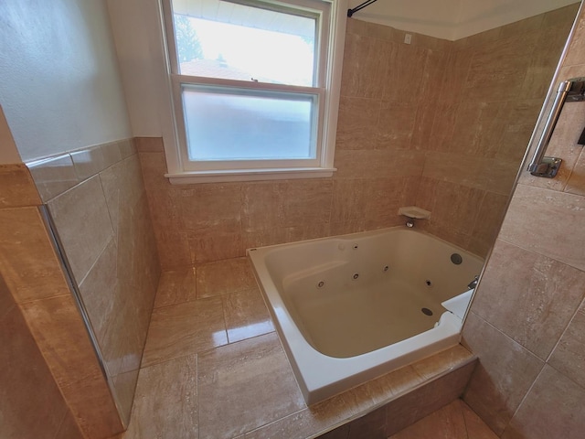 511 N Berwick Blvd, Waukegan, IL 60085 - bathroom with a tub with jets, tiled shower, and tile walls