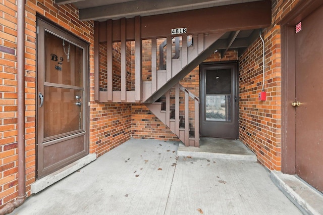 entrance to property with brick siding