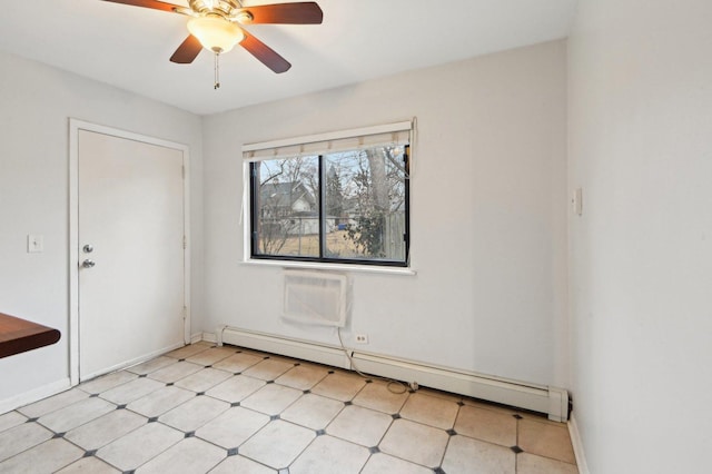 empty room with baseboard heating, ceiling fan, and baseboards