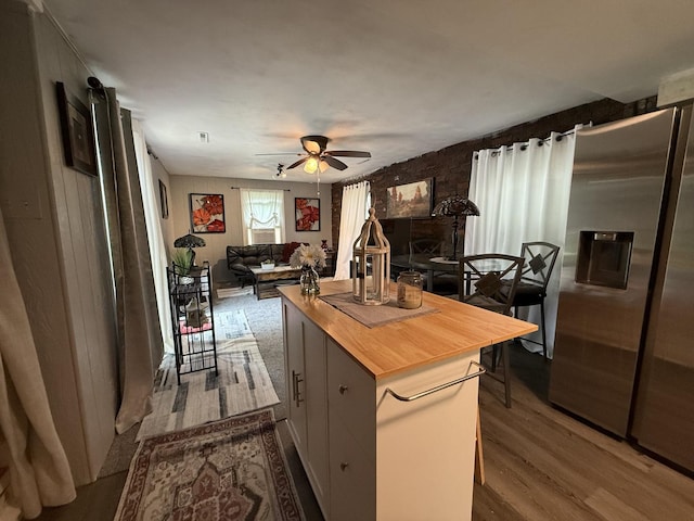 165 N Mill St, Cedarville, IL 61013 - kitchen featuring wooden counters, stainless steel fridge with ice dispenser, ceiling fan, dark wood-style floors, and open floor plan