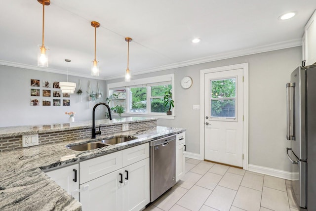 9017 Pottawattami Dr, Skokie, IL 60076 - kitchen with appliances with stainless steel finishes, a sink, white cabinetry, baseboards, and pendant lighting