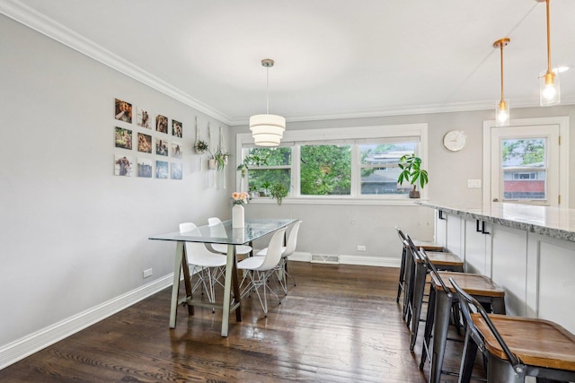 9017 Pottawattami Dr, Skokie, IL 60076 - dining area with dark wood-style floors, baseboards, and crown molding