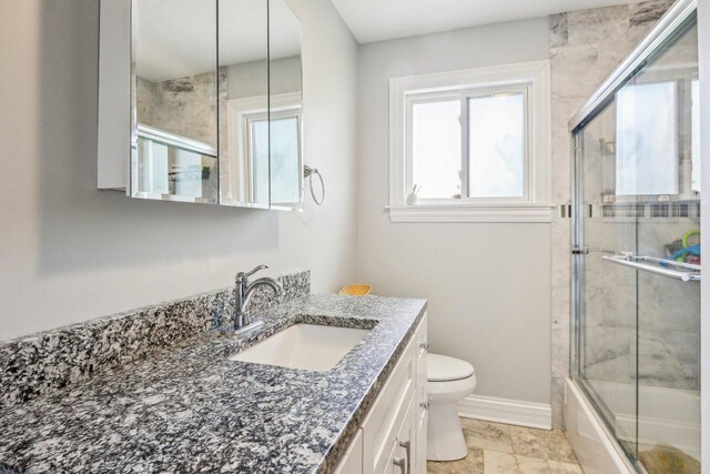 9017 Pottawattami Dr, Skokie, IL 60076 - bathroom with vanity, toilet, shower / bath combination with glass door, and marble finish floors