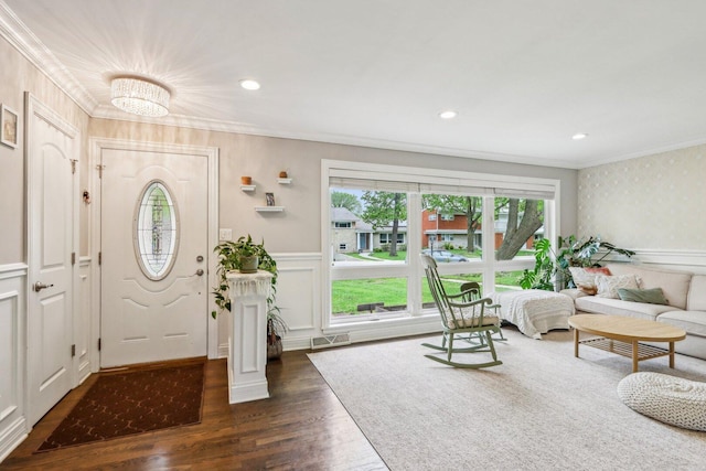 9017 Pottawattami Dr, Skokie, IL 60076 - foyer with crown molding, dark wood-style floors, a wainscoted wall, a decorative wall, and wallpapered walls