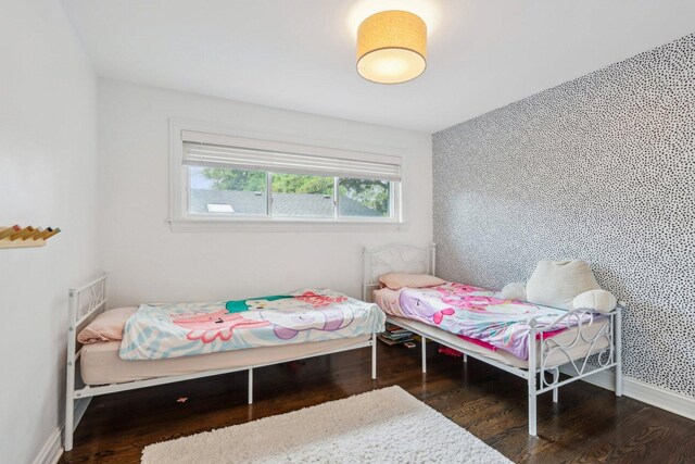 9017 Pottawattami Dr, Skokie, IL 60076 - bedroom featuring wood finished floors and baseboards