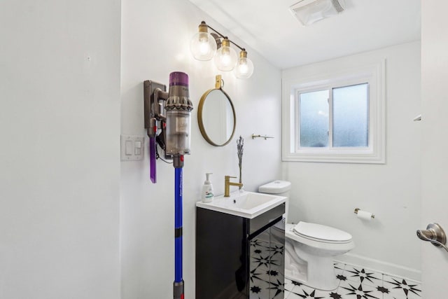 9017 Pottawattami Dr, Skokie, IL 60076 - bathroom with toilet, baseboards, tile patterned flooring, and vanity