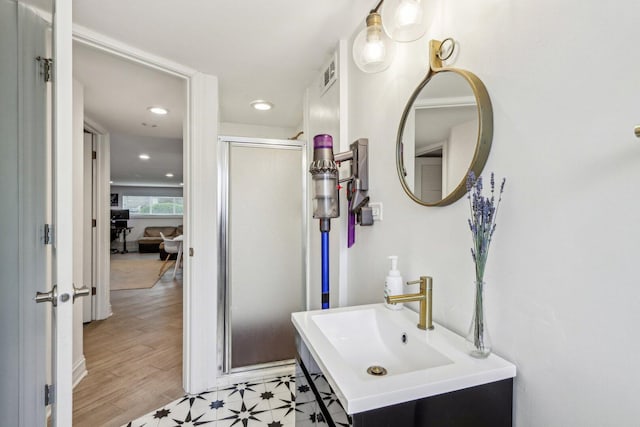 9017 Pottawattami Dr, Skokie, IL 60076 - bathroom with a stall shower, recessed lighting, and vanity