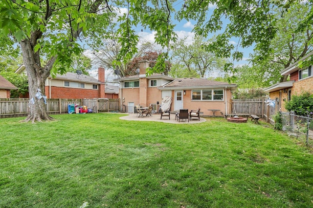 9017 Pottawattami Dr, Skokie, IL 60076 - back of property featuring a patio, a chimney, and brick siding