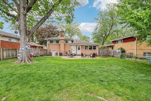 9017 Pottawattami Dr, Skokie, IL 60076 - back of house with a chimney, brick siding, a patio, and cooling unit