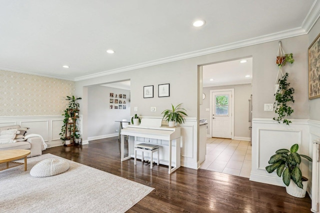 9017 Pottawattami Dr, Skokie, IL 60076 - living area featuring a decorative wall, crown molding, wainscoting, and wood finished floors