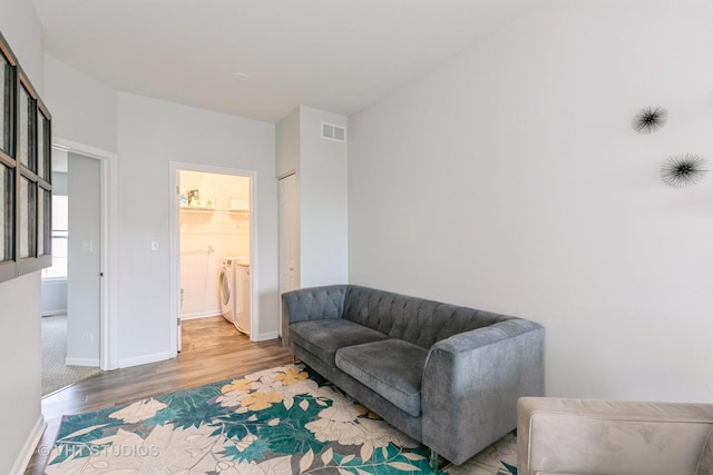 10636 153rd Pl, Orland Park, IL 60462 - living area with independent washer and dryer and light wood finished floors