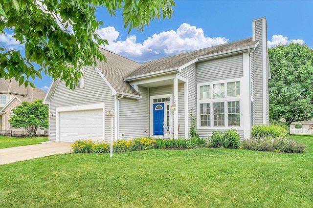 1208 Waters Edge Rd, Champaign, IL 61822 - view of front facade with a chimney, an attached garage, driveway, and a front lawn