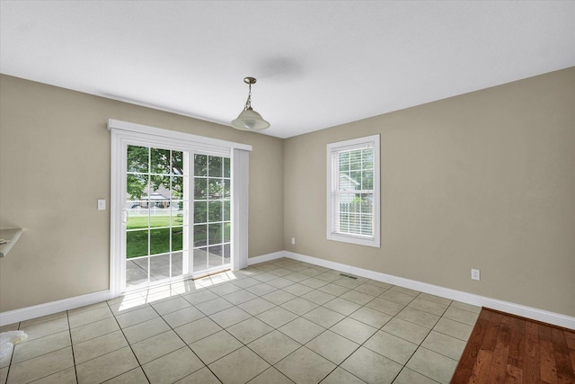 1208 Waters Edge Rd, Champaign, IL 61822 - empty room featuring plenty of natural light and light tile patterned floors