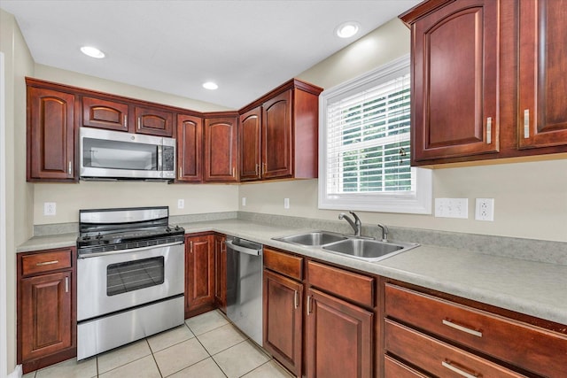 1208 Waters Edge Rd, Champaign, IL 61822 - kitchen with appliances with stainless steel finishes, light tile patterned flooring, light countertops, recessed lighting, and dark brown cabinets