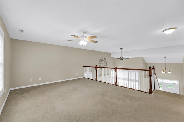 1208 Waters Edge Rd, Champaign, IL 61822 - carpeted spare room with ceiling fan and a chandelier