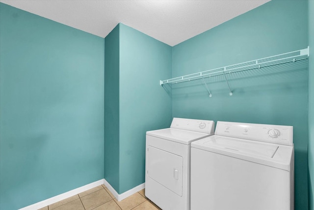 1208 Waters Edge Rd, Champaign, IL 61822 - laundry area with independent washer and dryer and light tile patterned floors