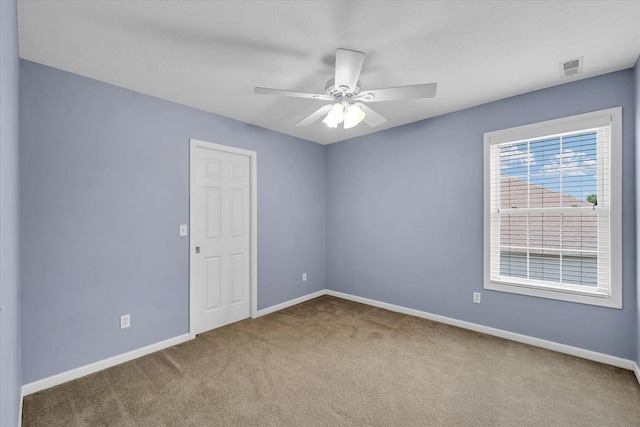 1208 Waters Edge Rd, Champaign, IL 61822 - carpeted empty room featuring baseboards and ceiling fan