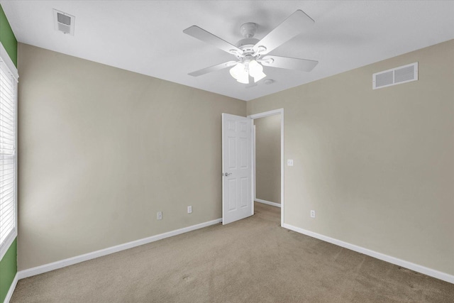 1208 Waters Edge Rd, Champaign, IL 61822 - empty room with carpet, ceiling fan, and healthy amount of natural light