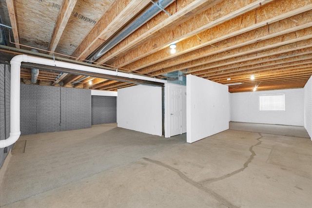 1208 Waters Edge Rd, Champaign, IL 61822 - basement featuring brick wall