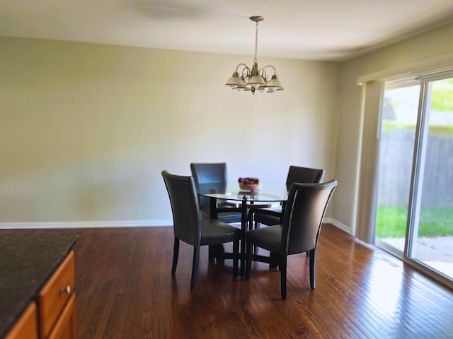 4156 S Sumter Dr, Matteson, IL 60443 - dining space featuring a chandelier, dark wood-style flooring, and baseboards