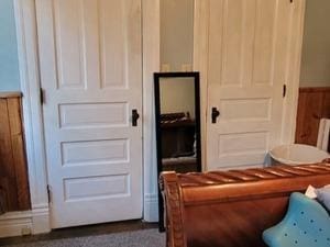 living area featuring wainscoting