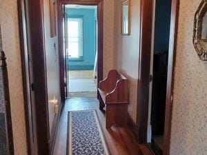 corridor with wallpapered walls