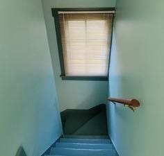 stairway featuring baseboards
